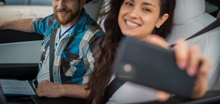 Lady showing a digital ID in car